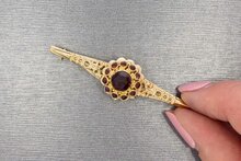 14 karaat gouden vintage broche met granaat  5,8 cm