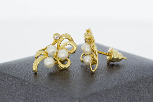 14 Karaat parel oorstekers met Diamant